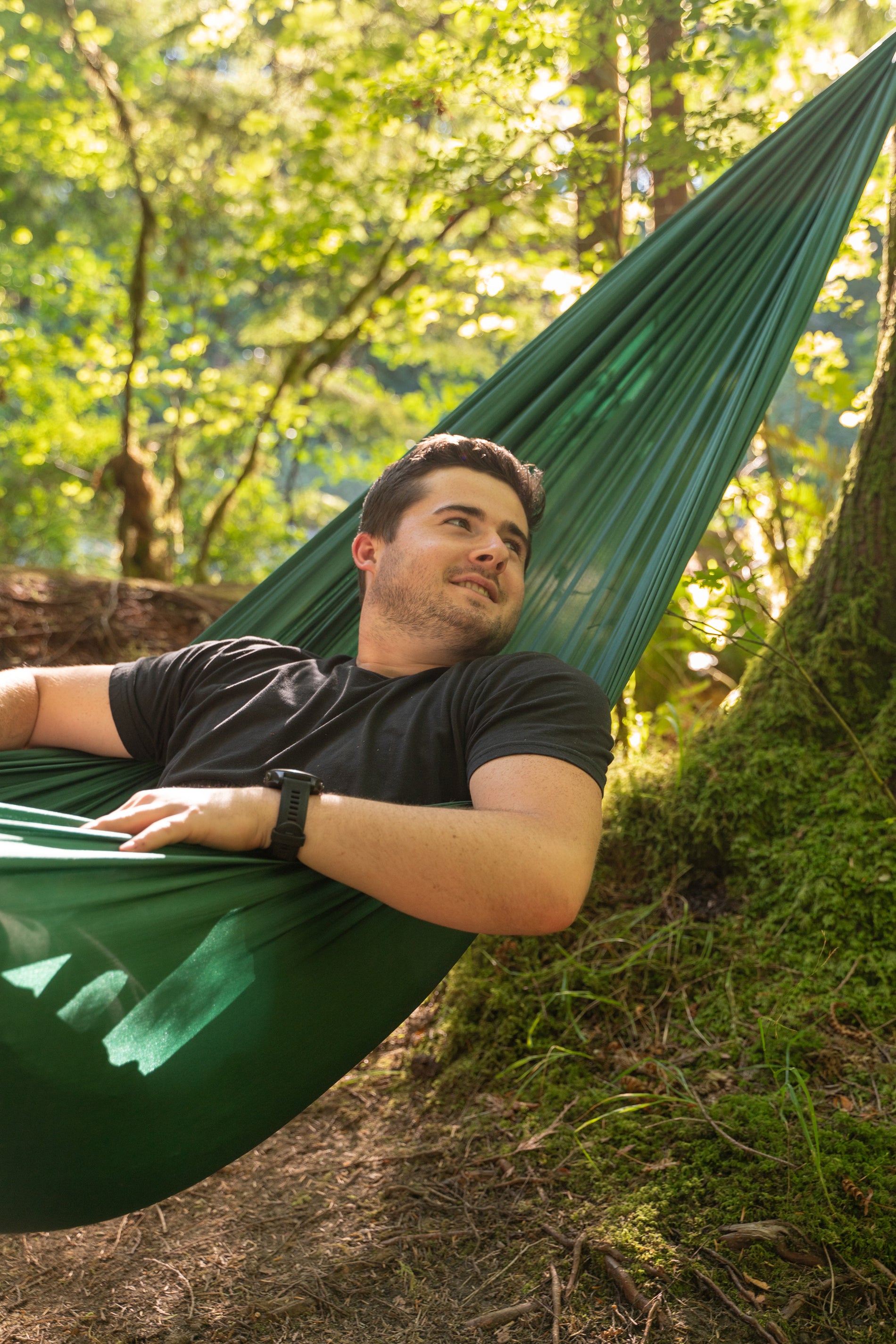 man smiling in hammock