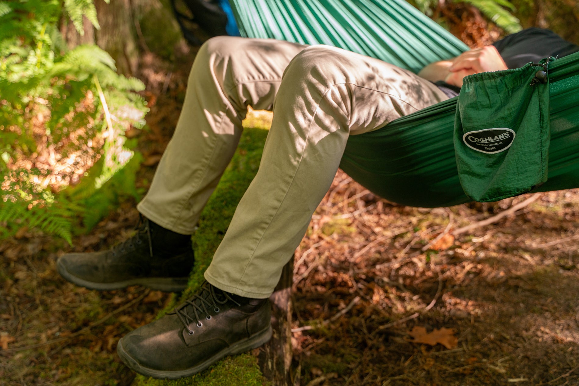 legs dangling from hammock